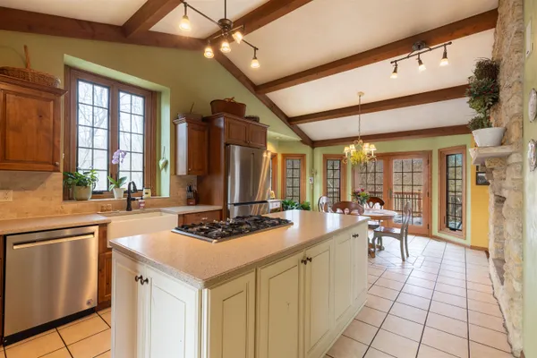 a bathroom with a granite countertop sink mirror and toilet