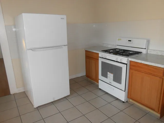 a view of a storage and utility room with washer and dryer