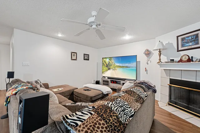 a view of a livingroom with furniture and a flat screen tv