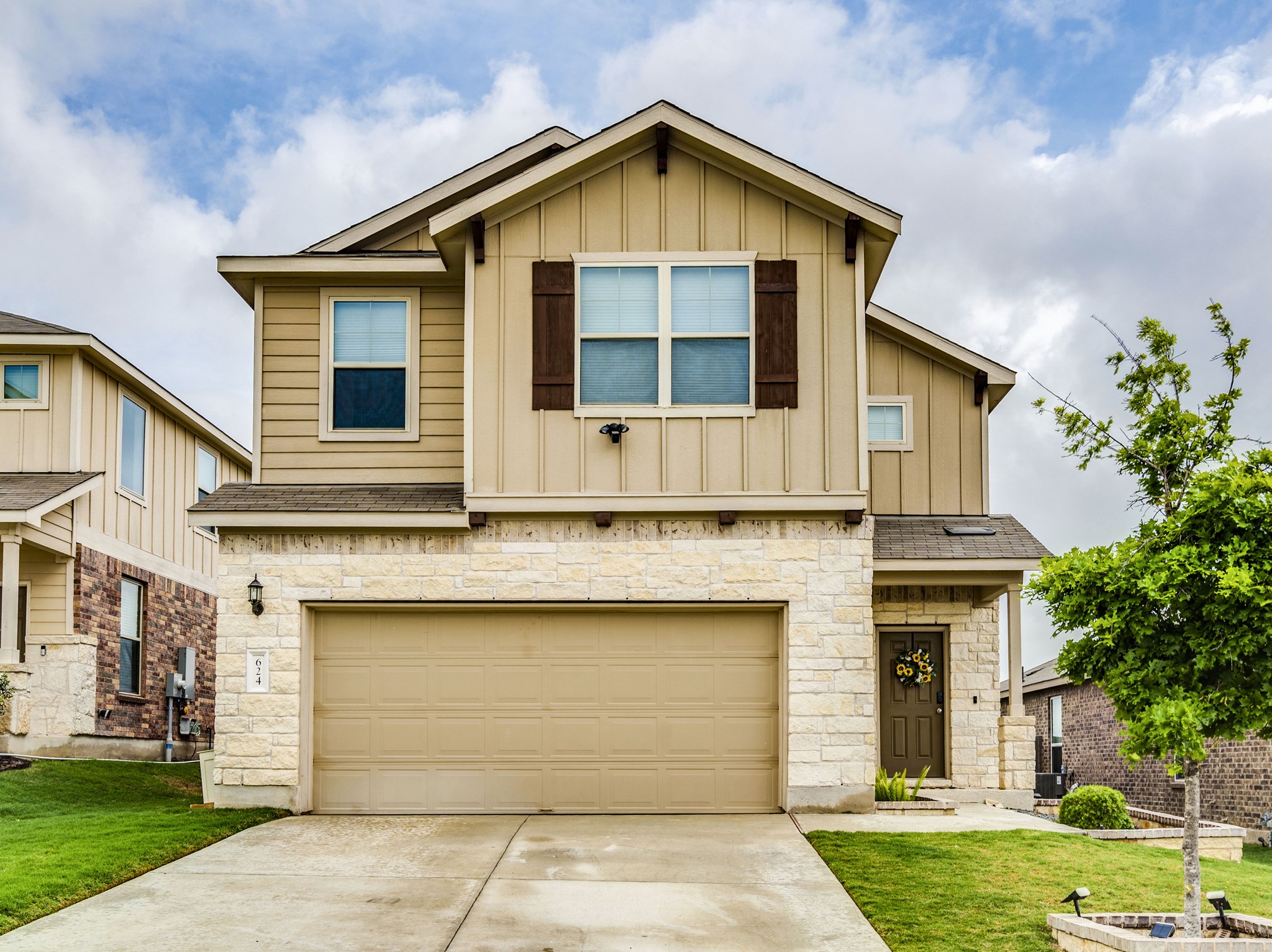 624 Pepperbark Loop Buda, TX 78610 - Photo 1 of 32 a front view of a house with a yard