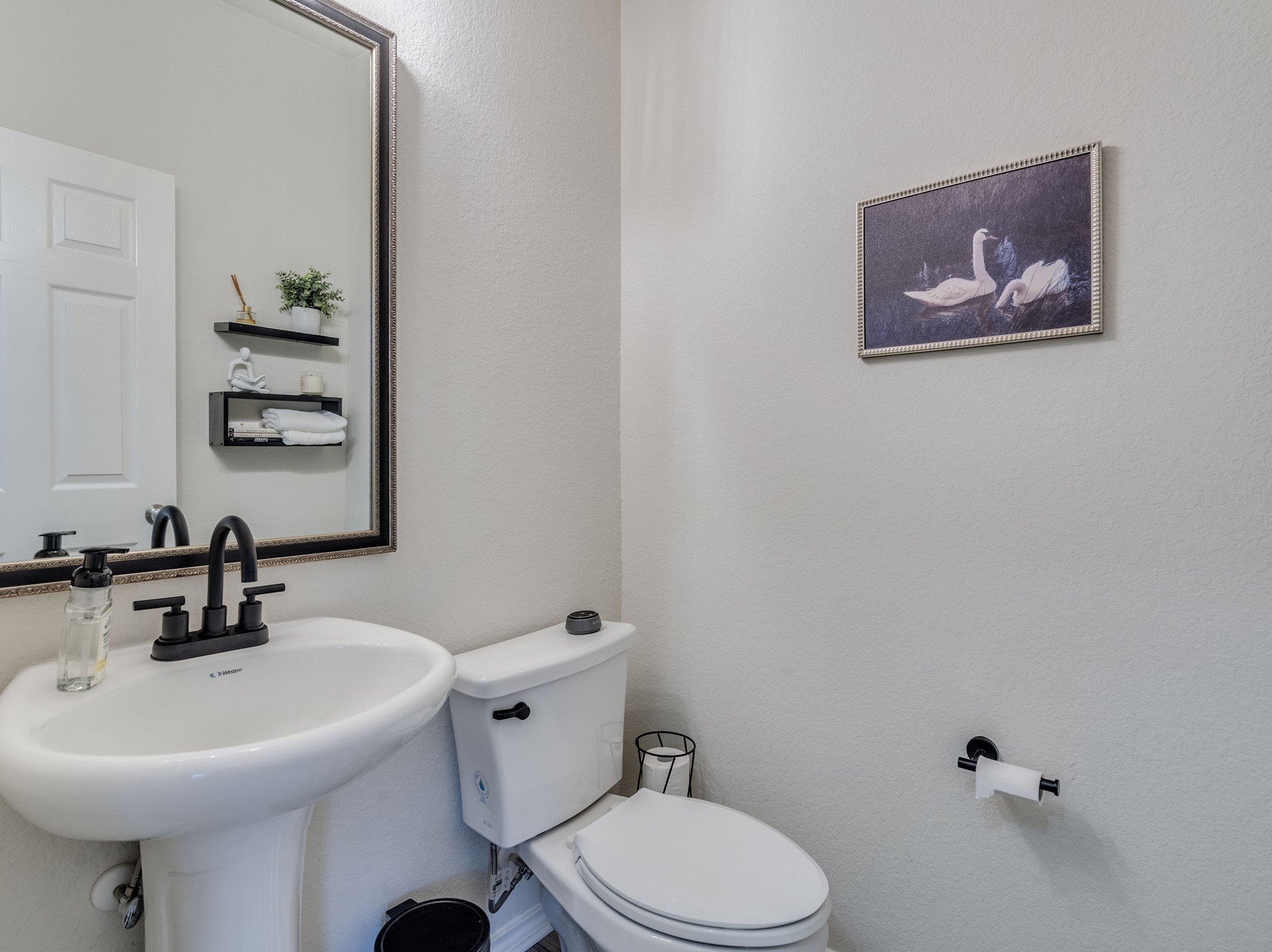 624 Pepperbark Loop Buda, TX 78610 - Photo 14 of 32 a bathroom with a sink mirror and toilet