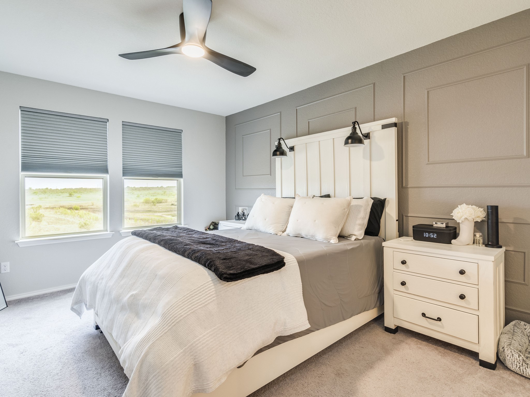 624 Pepperbark Loop Buda, TX 78610 - Photo 15 of 32 a bedroom with a bed and a window dresser