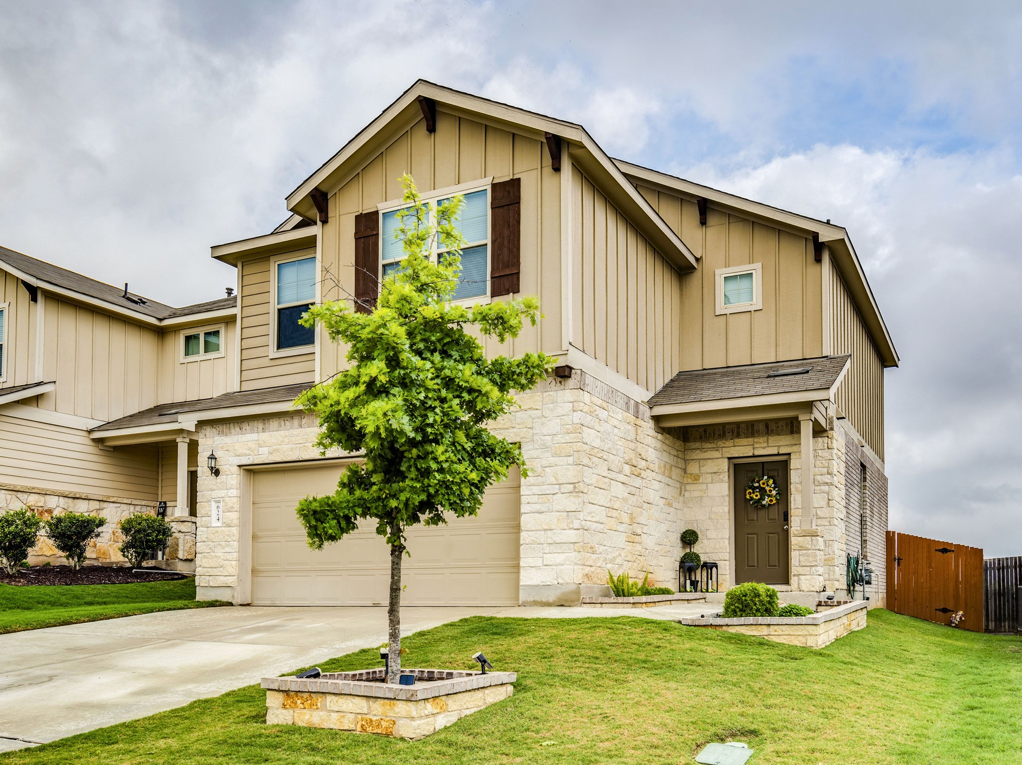 624 Pepperbark Loop Buda, TX 78610 - Photo 2 of 32 a front view of a house with a yard
