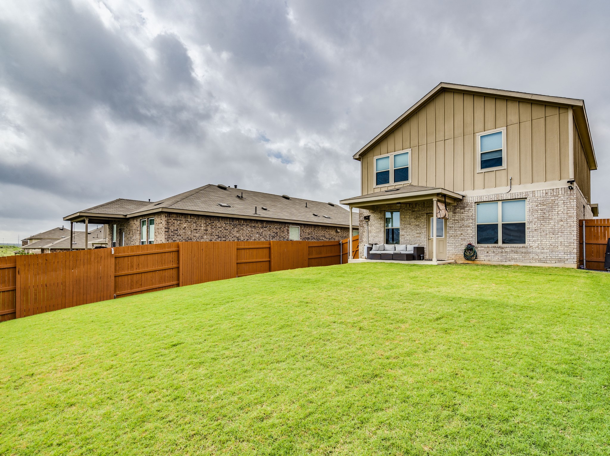 624 Pepperbark Loop Buda, TX 78610 - Photo 25 of 32 a front view of house with yard and garage