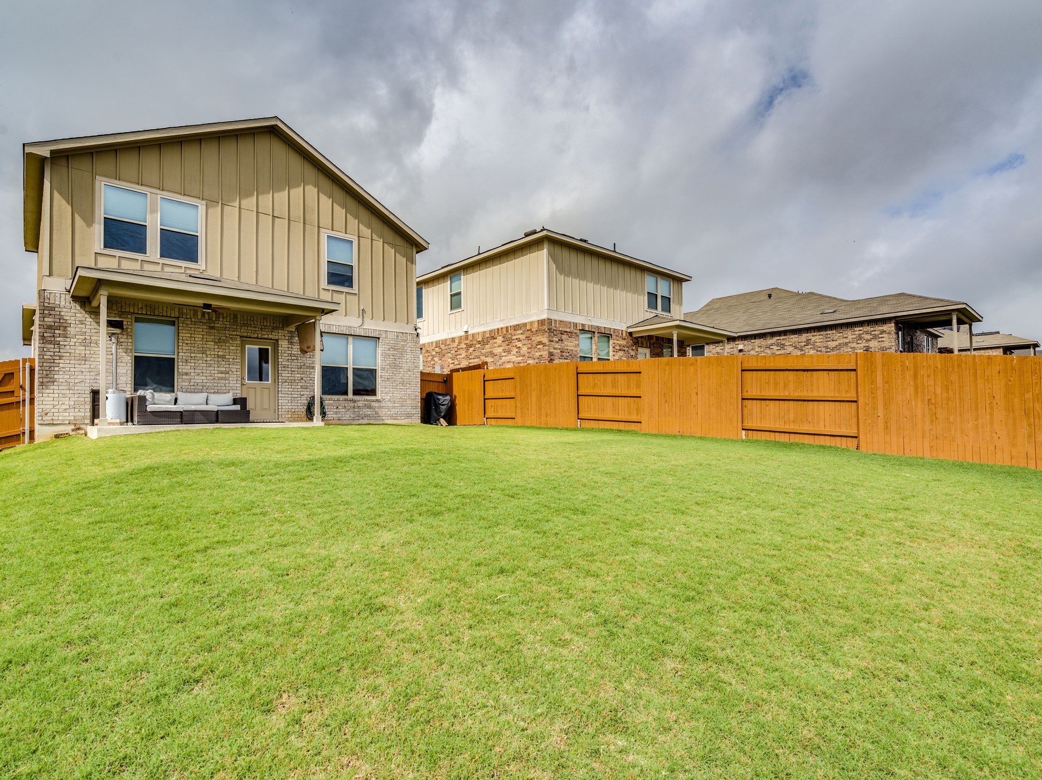 624 Pepperbark Loop Buda, TX 78610 - Photo 26 of 32 a front view of a house with a yard