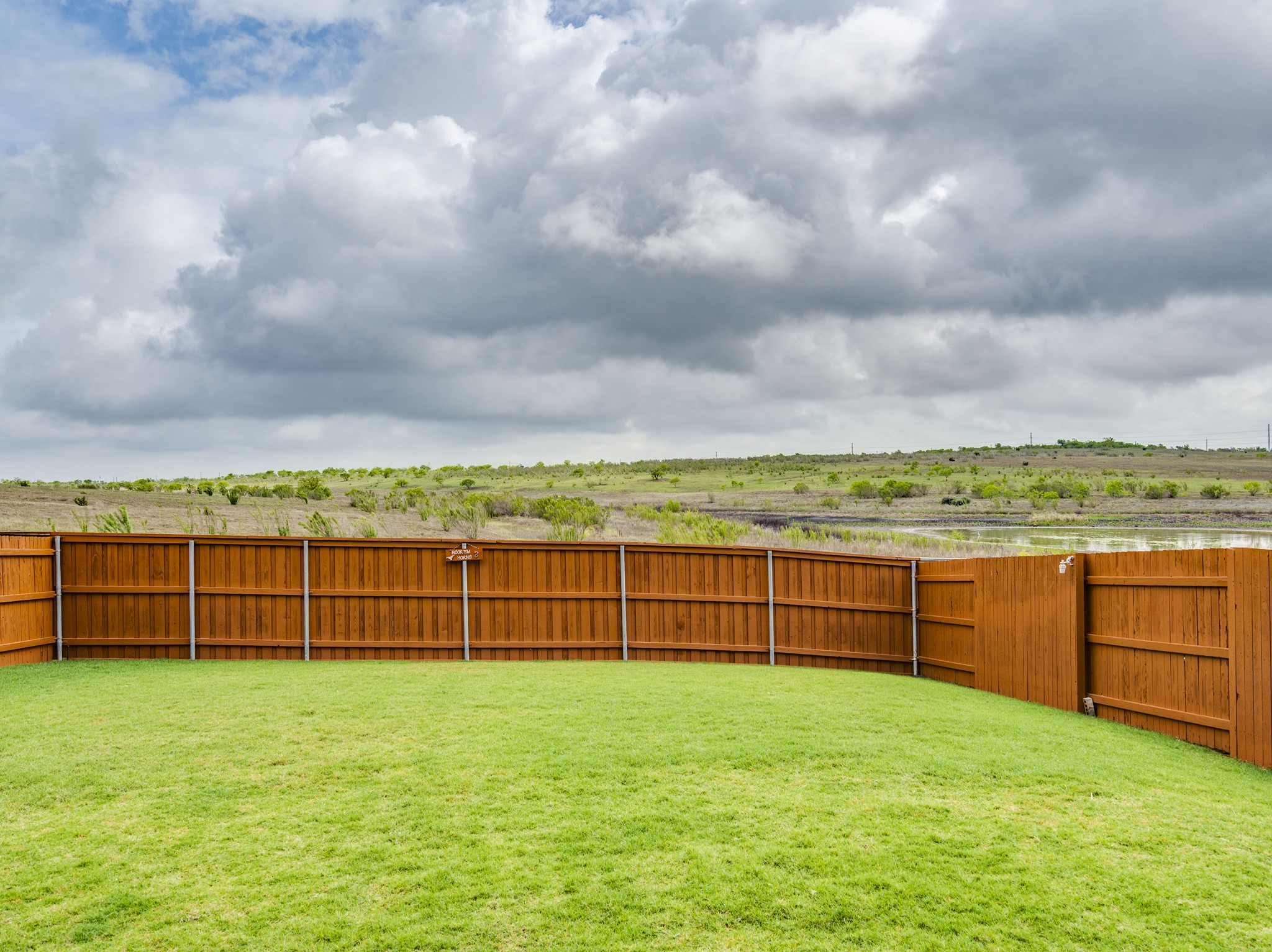 624 Pepperbark Loop Buda, TX 78610 - Photo 29 of 32 a view of a yard with a wooden fence