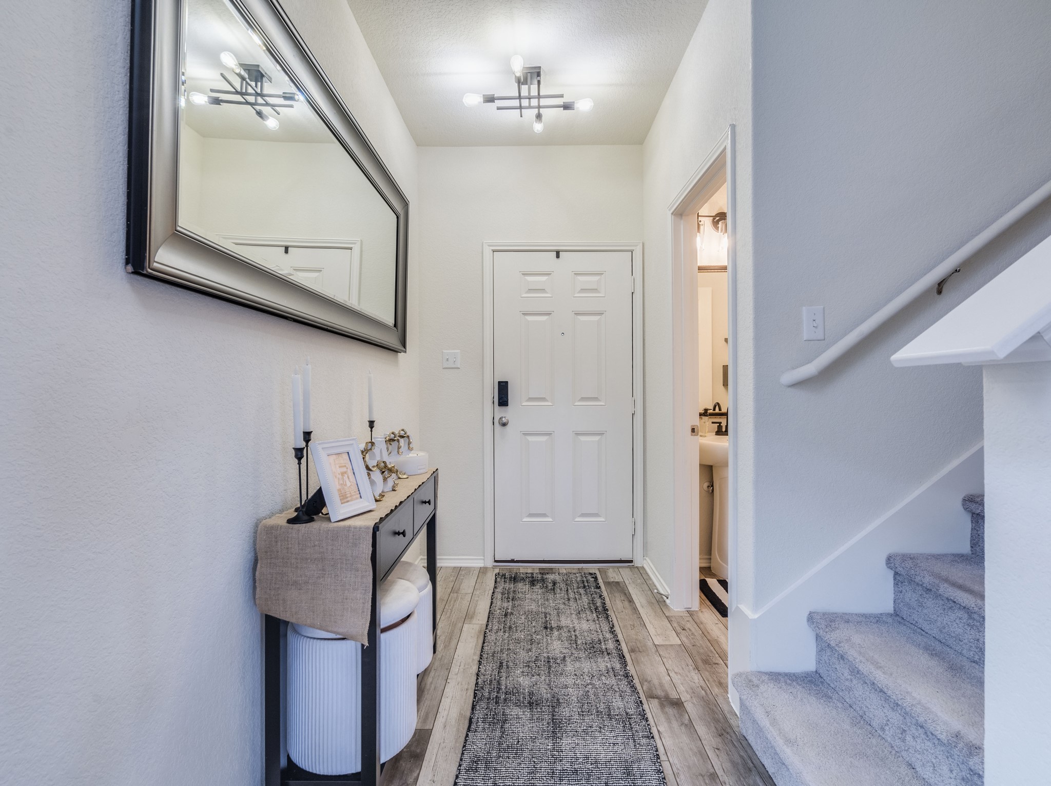 624 Pepperbark Loop Buda, TX 78610 - Photo 4 of 32 a view of a hallway with seating area