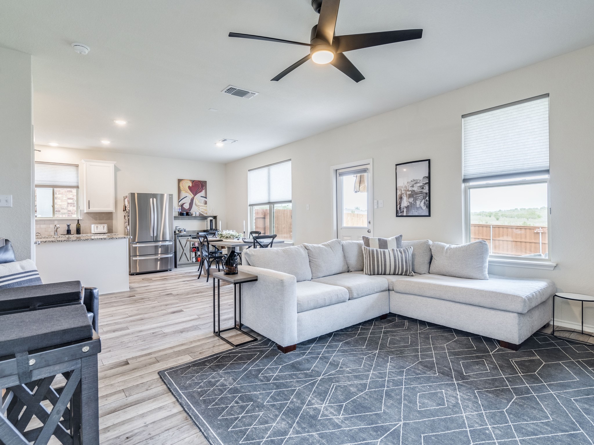 624 Pepperbark Loop Buda, TX 78610 - Photo 5 of 32 a living room with furniture and a wooden floor