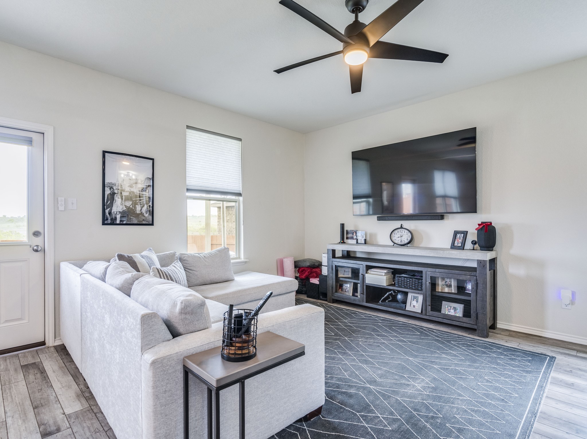 624 Pepperbark Loop Buda, TX 78610 - Photo 6 of 32 a living room with furniture and a flat screen tv