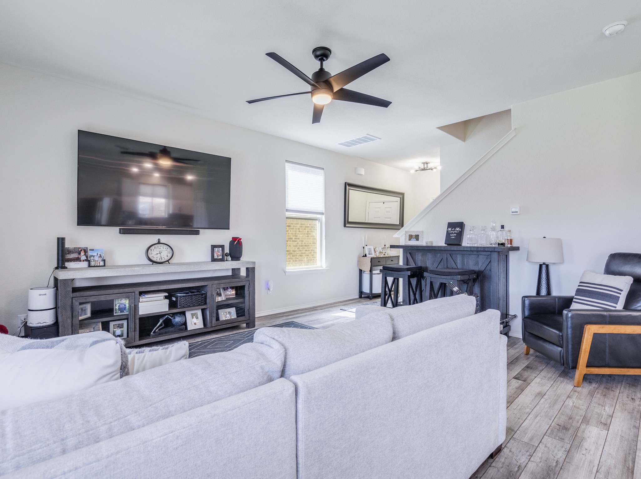 624 Pepperbark Loop Buda, TX 78610 - Photo 7 of 32 a living room with furniture and a flat screen tv