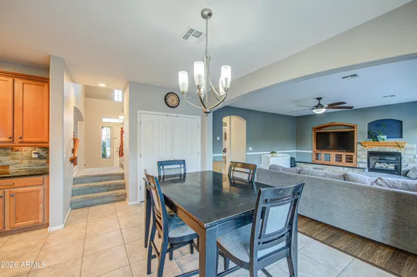 a kitchen with stainless steel appliances granite countertop a refrigerator a stove a sink and a microwave
