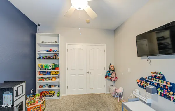 a spacious bathroom with a tub sink and mirror
