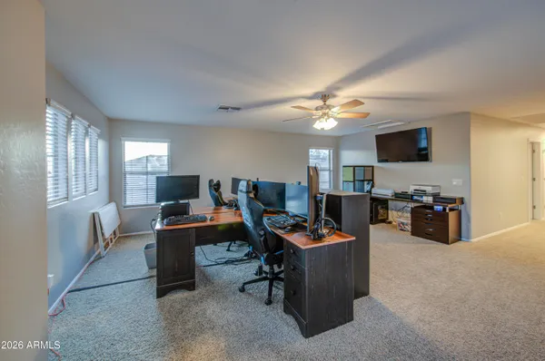 a view of a livingroom with a ceiling fan