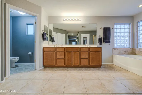 a bathroom with a shower a toilet and a shower