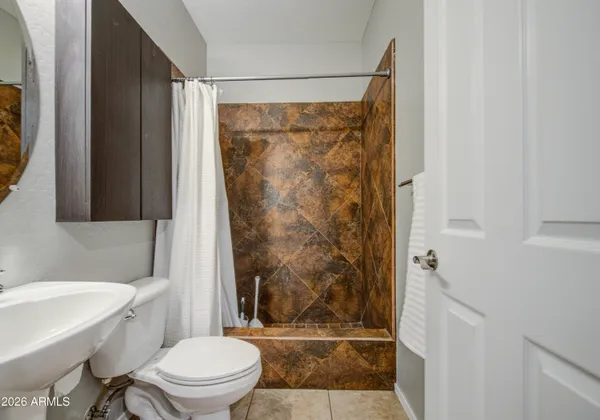 a view of a two chairs in the patio