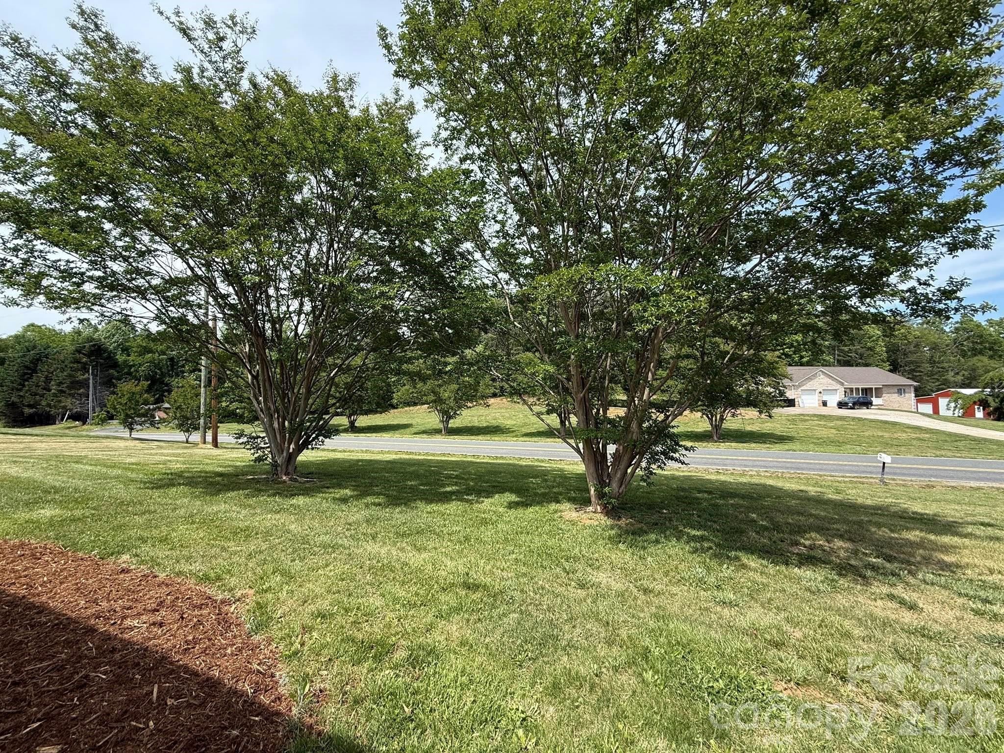 2677 Pax Hill Road Morganton, NC 28655 - Photo 3 of 15 a view of backyard with swimming pool and green space