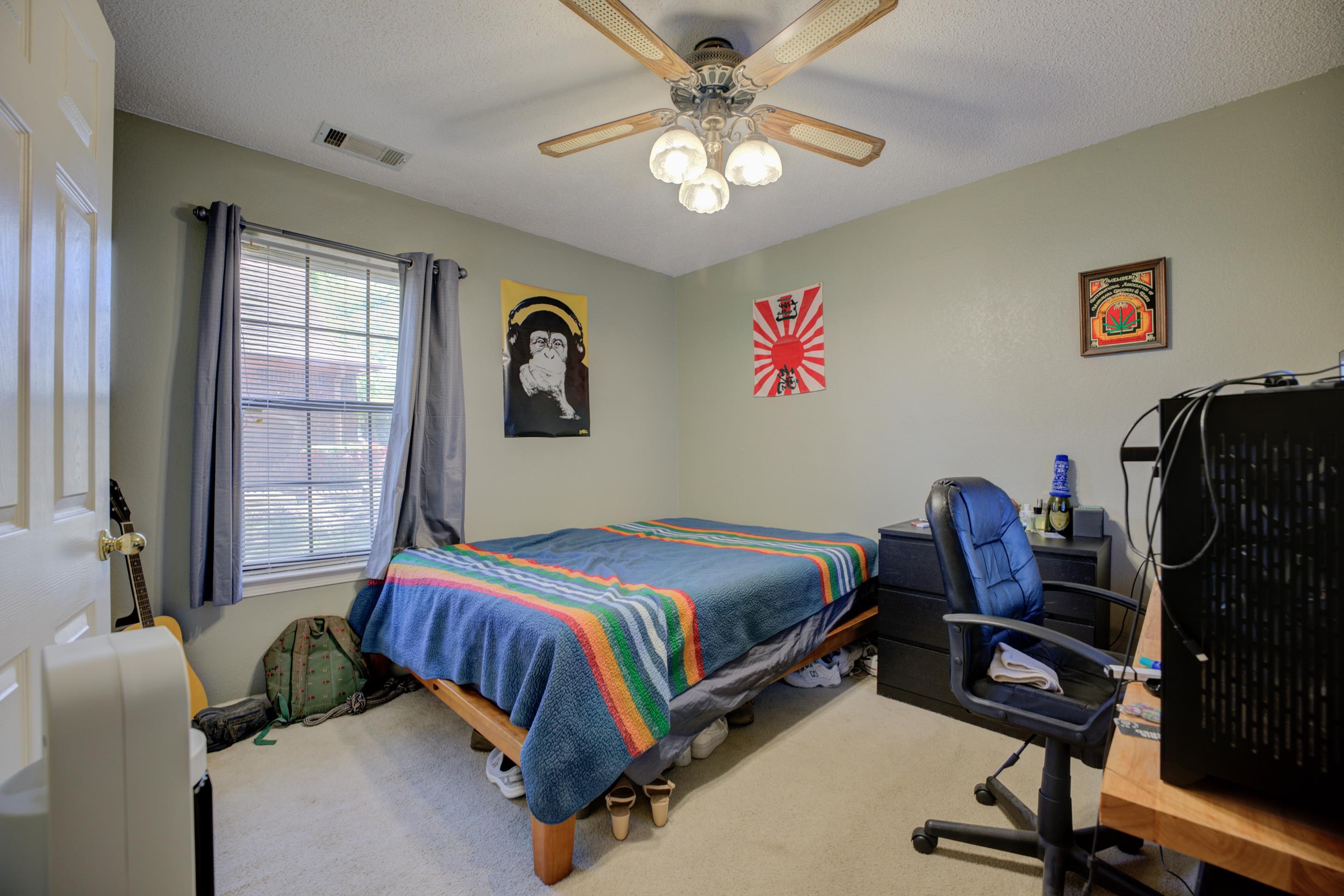 5382 Ross Road Memphis, TN 38141 - Photo 23 of 27 Bedroom featuring visible vents, a textured ceiling, a ceiling fan, and carpet floors