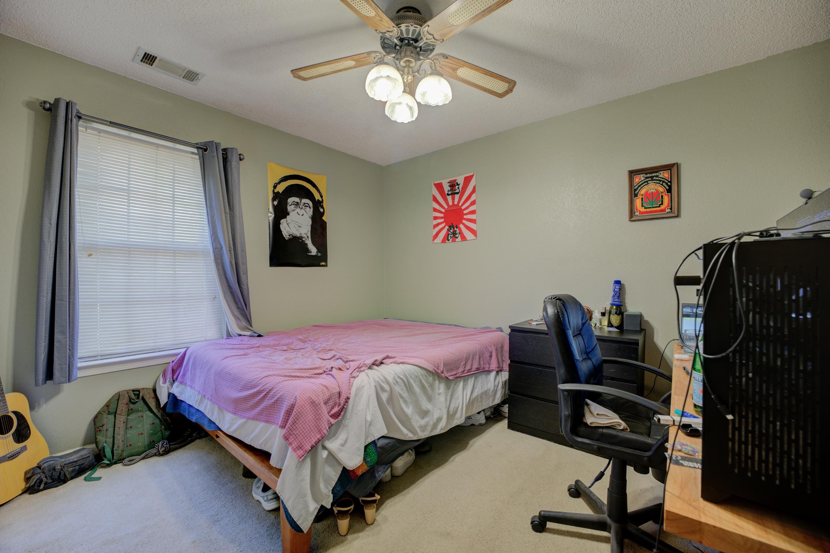 5382 Ross Road Memphis, TN 38141 - Photo 24 of 27 Carpeted bedroom featuring visible vents, ceiling fan, and a textured ceiling