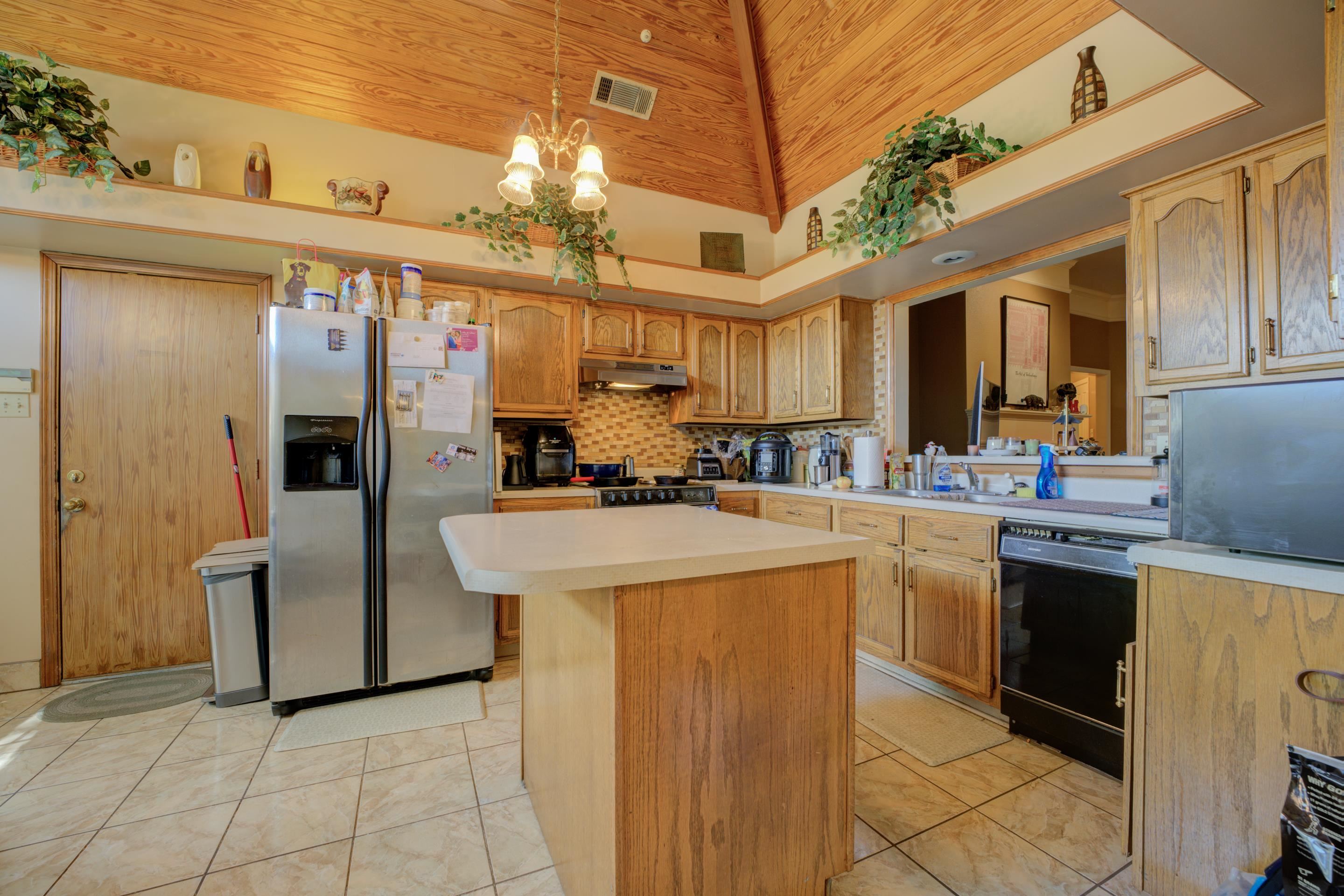 5382 Ross Road Memphis, TN 38141 - Photo 6 of 27 Kitchen featuring stainless steel refrigerator with ice dispenser, wood ceiling, under cabinet range hood, dishwasher, and range with electric cooktop