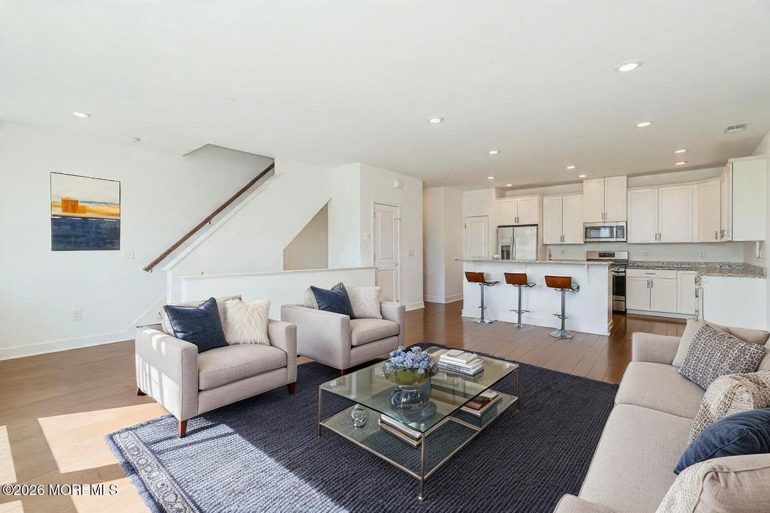 37 Midway Road North Tinton Falls, NJ 07724 - Photo 12 of 46 a living room with furniture wooden floor and kitchen view