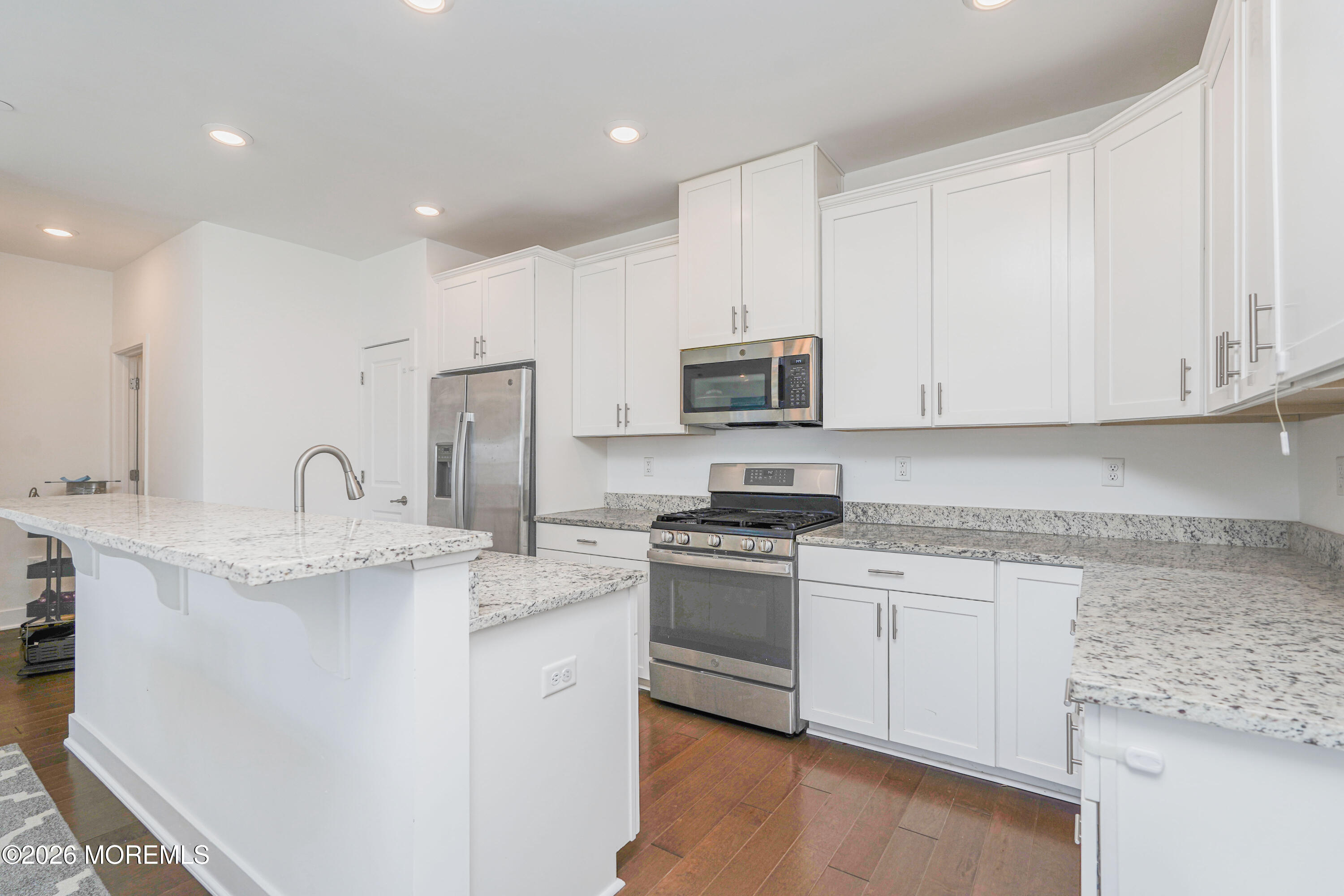 37 Midway Road North Tinton Falls, NJ 07724 - Photo 15 of 46 a kitchen with stainless steel appliances granite countertop a stove a sink dishwasher and a refrigerator