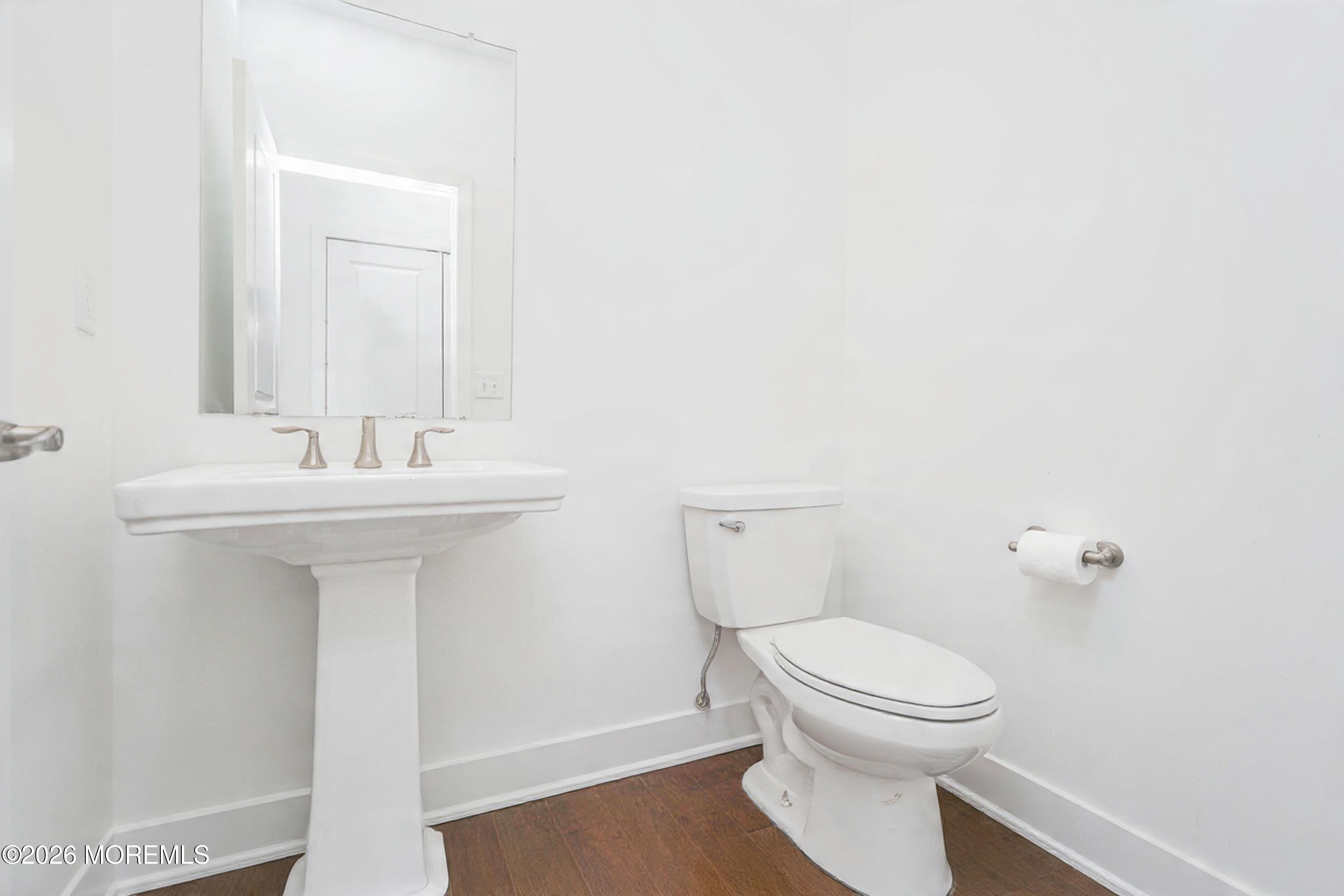 37 Midway Road North Tinton Falls, NJ 07724 - Photo 17 of 46 a bathroom with a sink a toilet and mirror