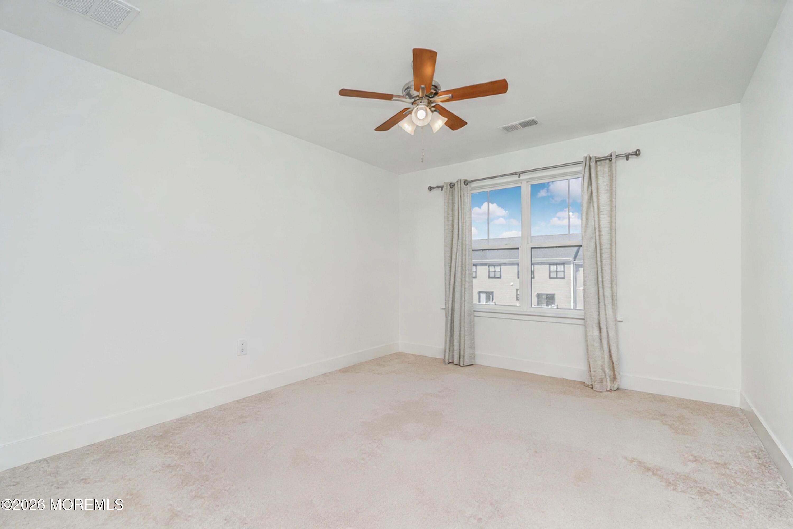 37 Midway Road North Tinton Falls, NJ 07724 - Photo 18 of 46 a view of an empty room and chandelier fan
