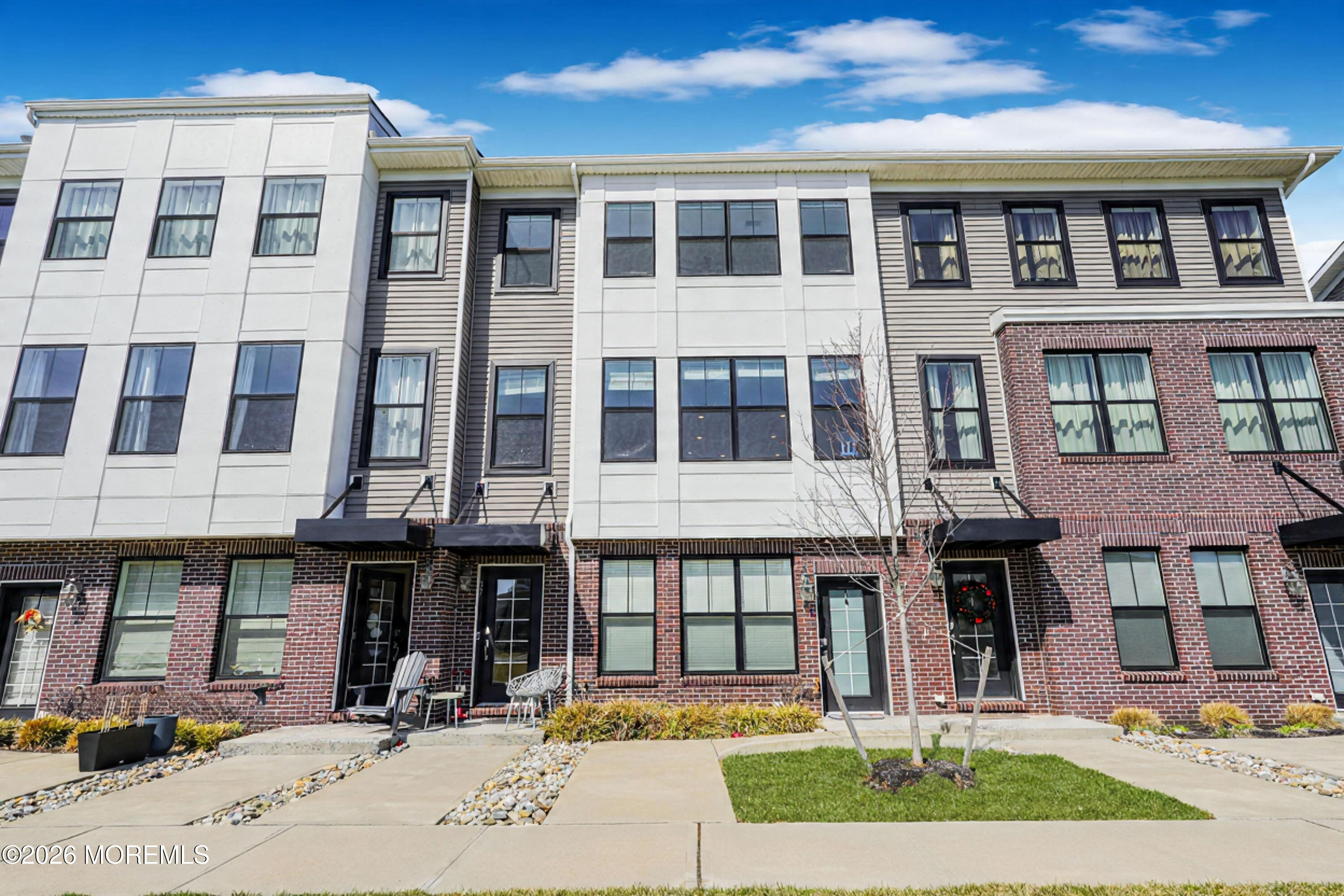 37 Midway Road North Tinton Falls, NJ 07724 - Photo 2 of 46 a front view of a building with a garden and pathway