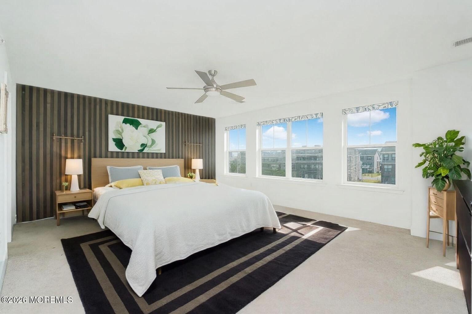 37 Midway Road North Tinton Falls, NJ 07724 - Photo 27 of 46 a large bed sitting in a bedroom next to a window