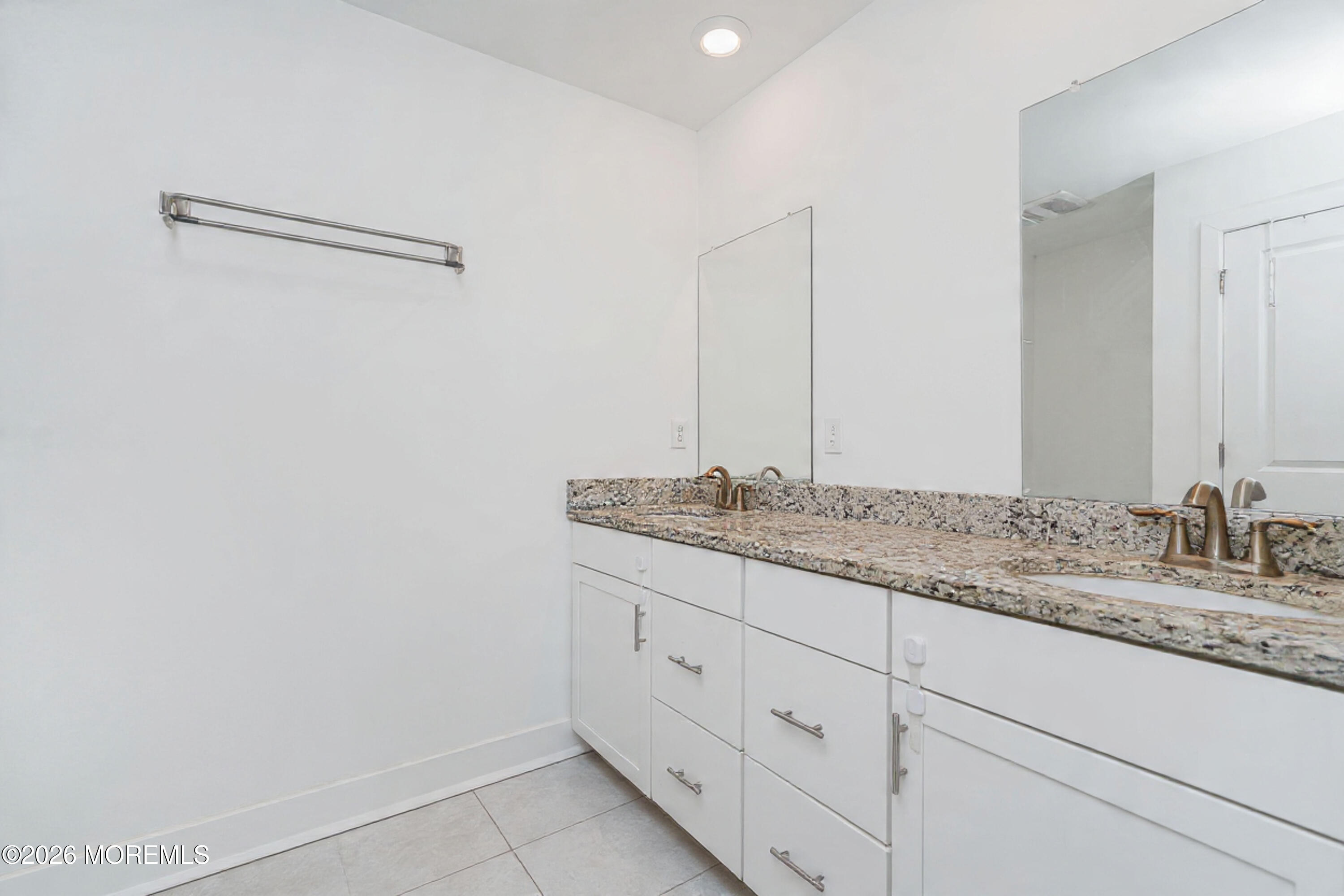 37 Midway Road North Tinton Falls, NJ 07724 - Photo 30 of 46 a bathroom with a granite countertop sink and a mirror