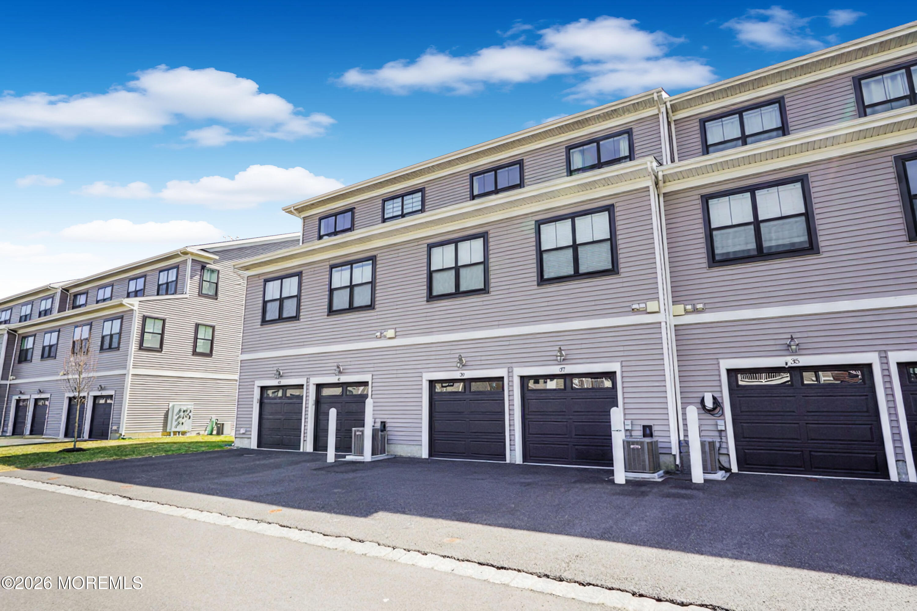 37 Midway Road North Tinton Falls, NJ 07724 - Photo 38 of 46 a front view of a building with many windows
