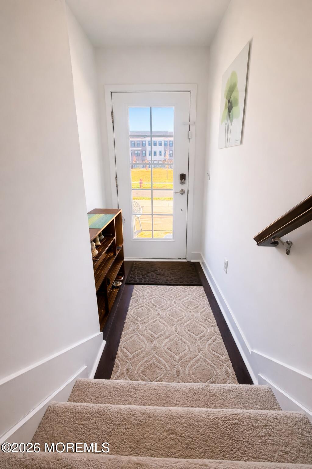 37 Midway Road North Tinton Falls, NJ 07724 - Photo 4 of 46 a view of a hallway with wooden floor and a window