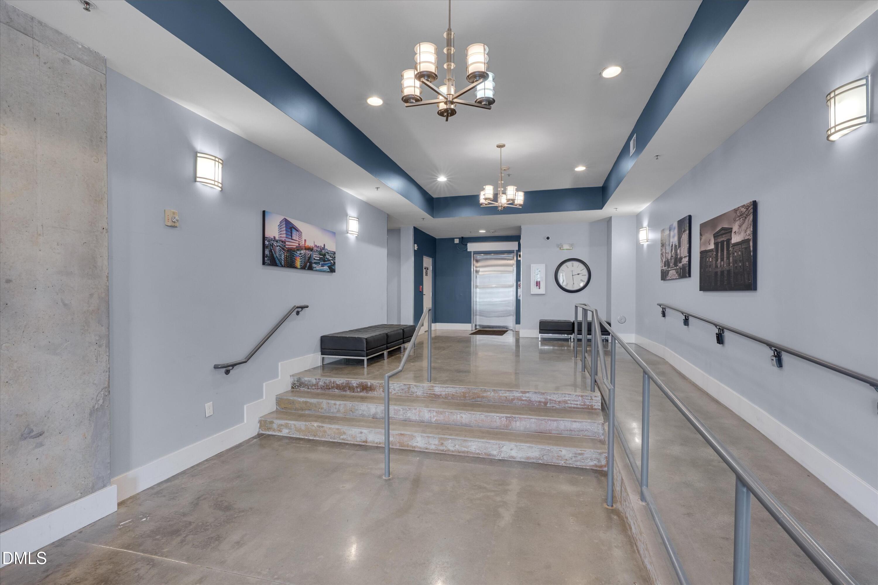 444 South Blount Street, Unit 120 Raleigh, NC 27601 - Photo 18 of 29 a view of living room with furniture and a flat screen tv