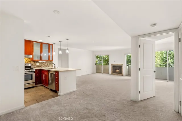 a view of a kitchen with a sink and cabinets