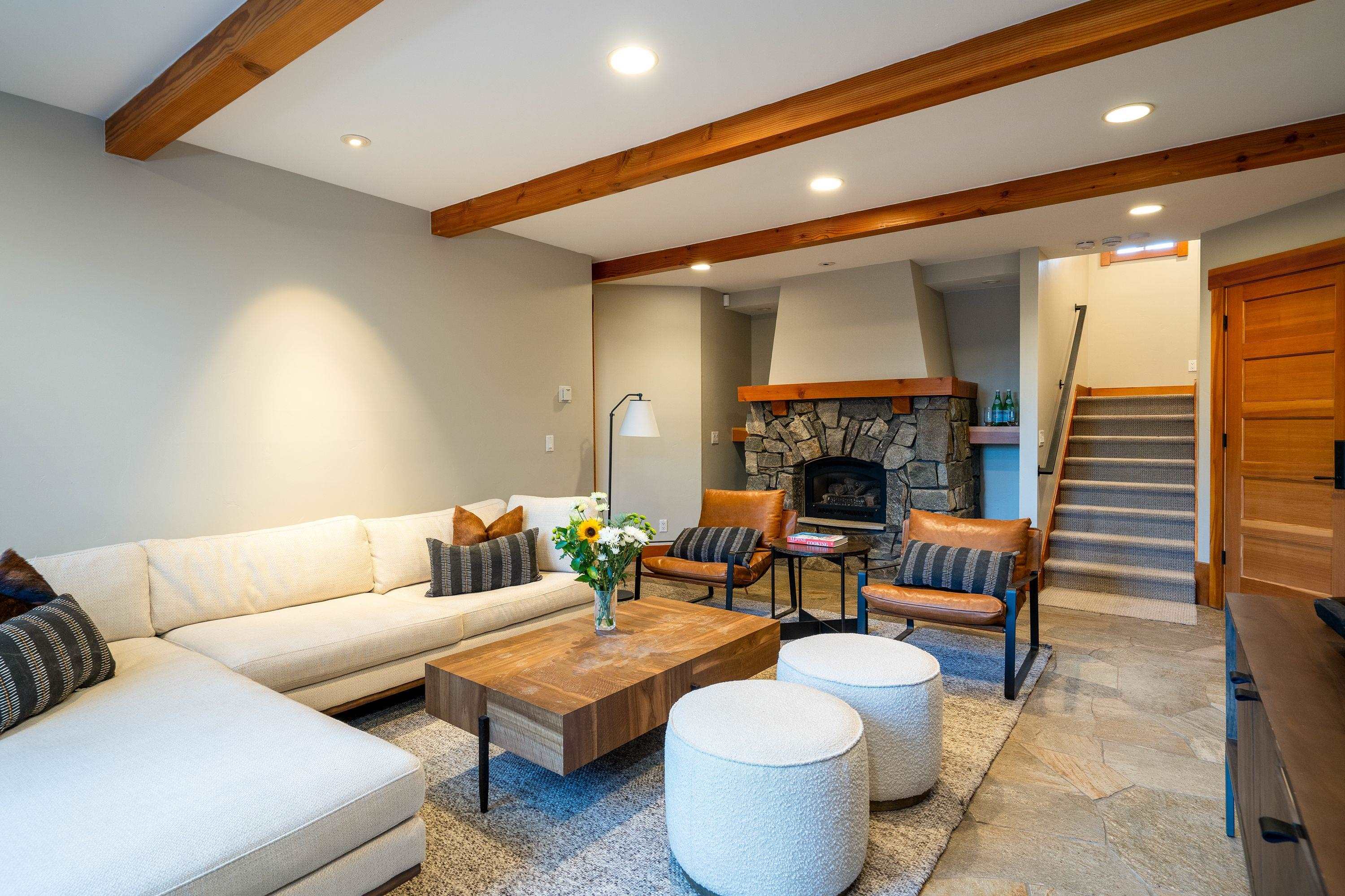 1723 Grouse Ridge Road Truckee, CA 96161 - Photo 9 of 27 a living room with furniture and a fireplace