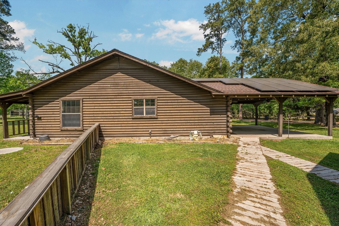 12049 Clark Lane Conroe, TX 77385 - Photo 26 of 40 a view of a house with backyard and sitting area