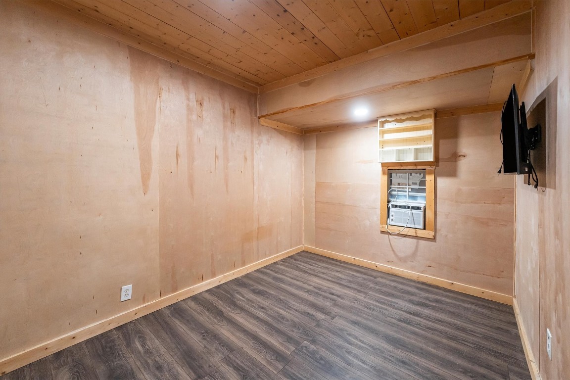 12049 Clark Lane Conroe, TX 77385 - Photo 29 of 40 a view of empty room with wooden floor and fan