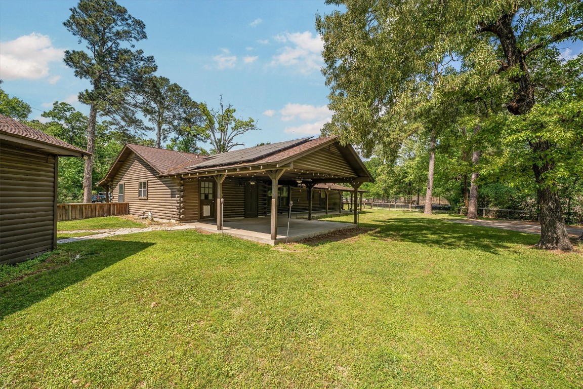 12049 Clark Lane Conroe, TX 77385 - Photo 37 of 40 a front view of a house with yard and green space