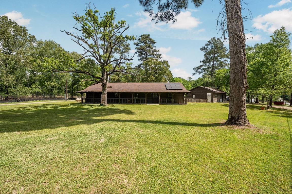 12049 Clark Lane Conroe, TX 77385 - Photo 6 of 40 a view of a house with a big yard