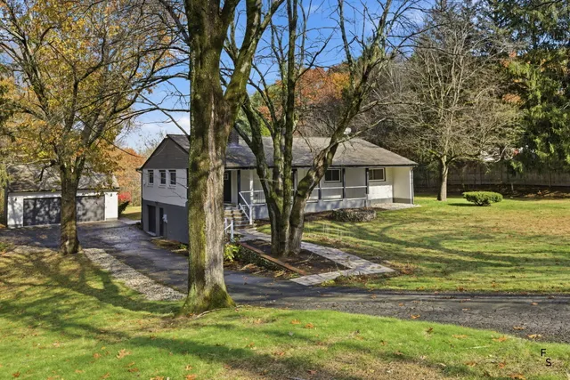 a view of a house with a yard