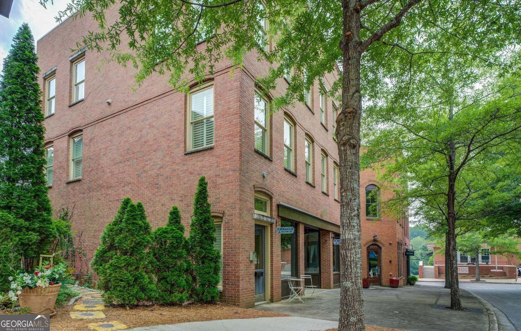 4165 Raphael Street Covington, GA 30014 - Photo 2 of 25 front view of a building with a tree