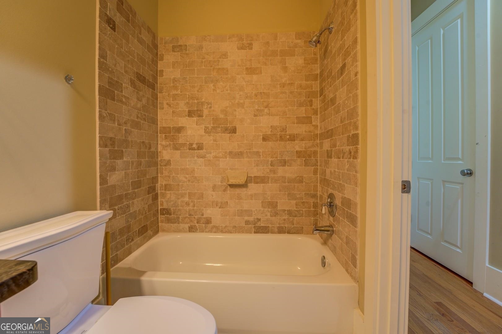 4165 Raphael Street Covington, GA 30014 - Photo 22 of 25 a bathroom with a shower and a toilet