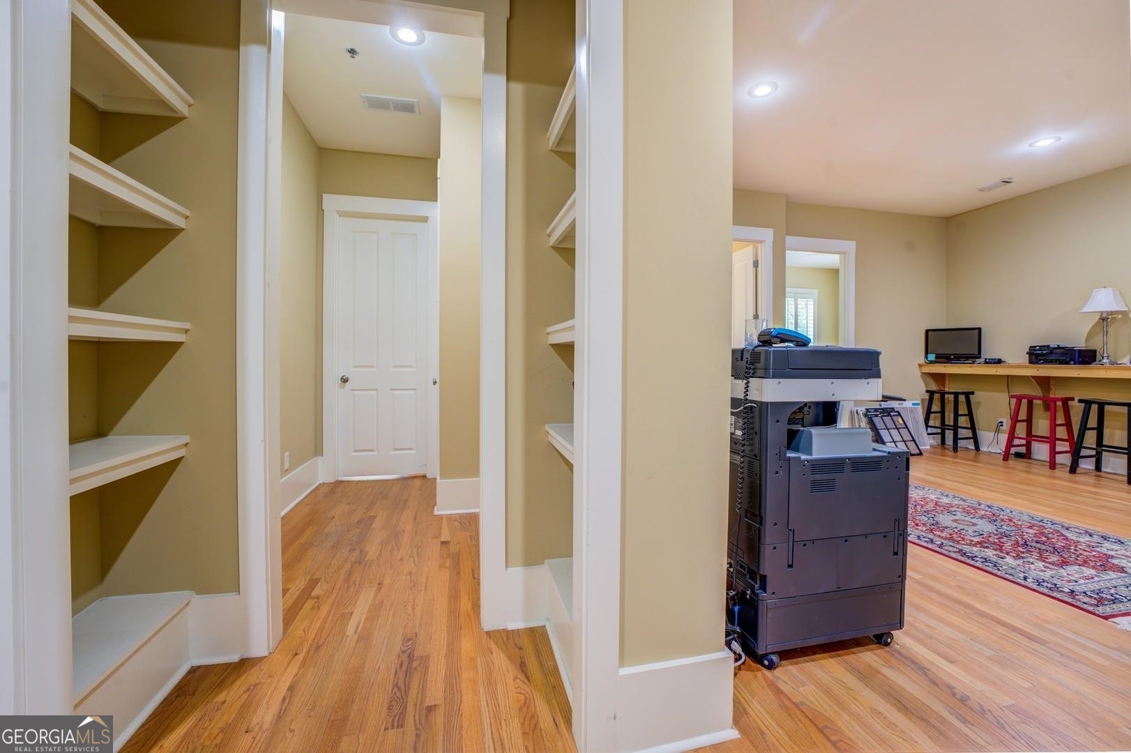 4165 Raphael Street Covington, GA 30014 - Photo 23 of 25 a view of a kitchen and an entryway with wooden floor