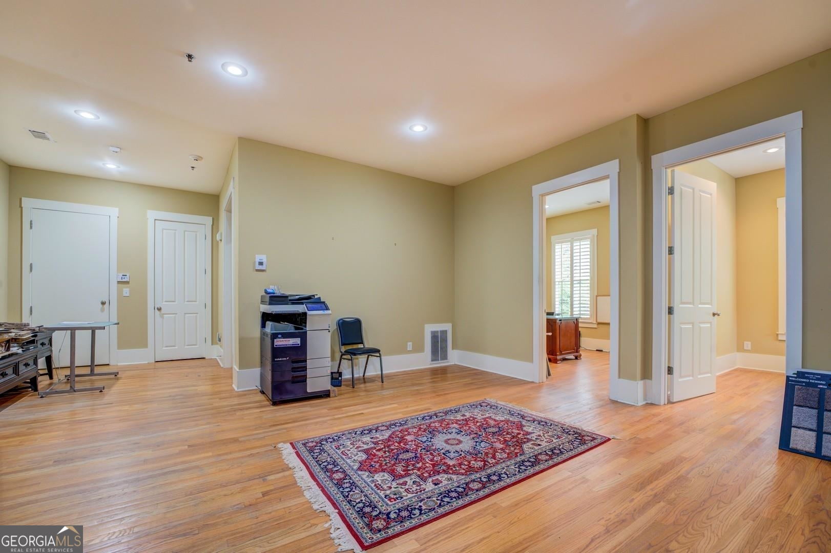4165 Raphael Street Covington, GA 30014 - Photo 5 of 25 a living room with furniture and a wooden floor