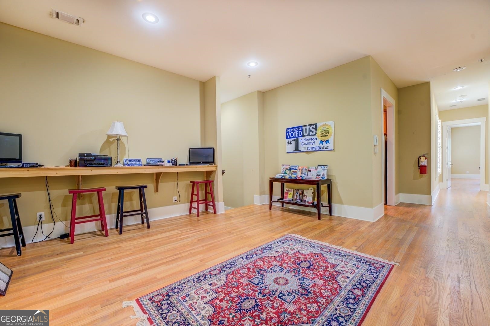 4165 Raphael Street Covington, GA 30014 - Photo 7 of 25 a living room with furniture and a wooden floor