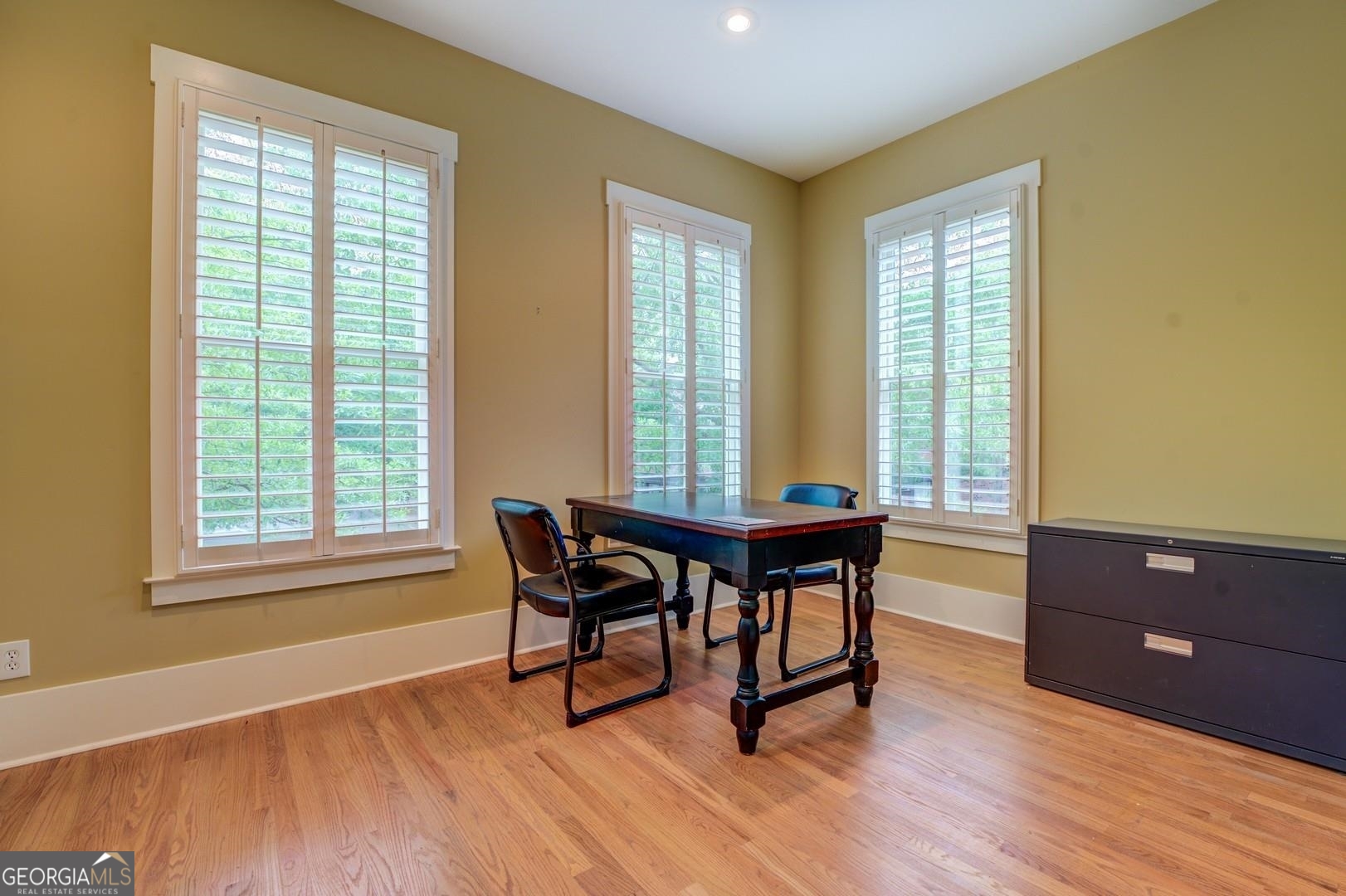 4165 Raphael Street Covington, GA 30014 - Photo 10 of 25 a view of a workspace with furniture and a window
