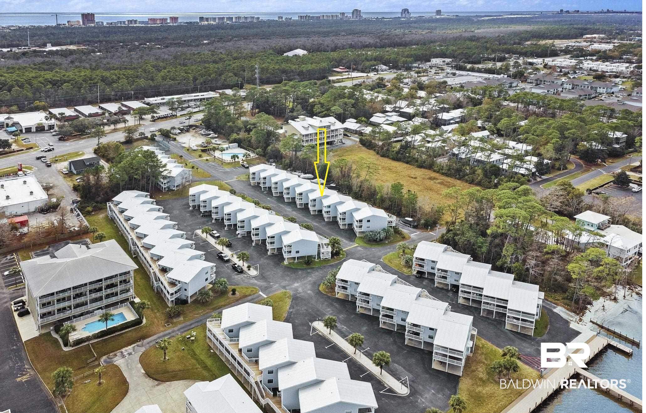 25861 Canal Road, Unit 77 Orange Beach, AL 36561 - Photo 3 of 48 Aerial view of property's location featuring nearby suburban area