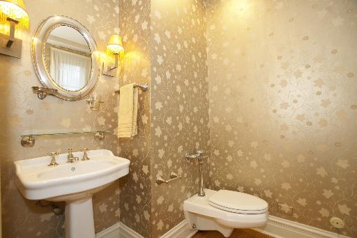 1255 North State Parkway, Unit 5D Chicago, IL 60610 - Photo 14 of 16 a bathroom with a sink a mirror and a toilet