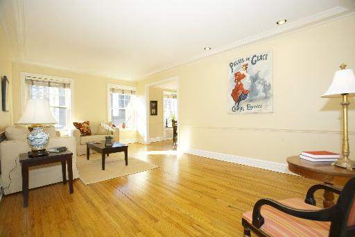 1255 North State Parkway, Unit 5D Chicago, IL 60610 - Photo 5 of 16 a living room with furniture and a table