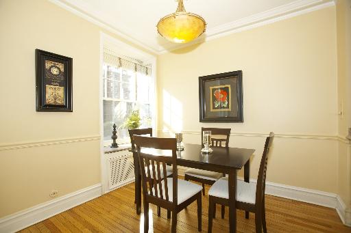 1255 North State Parkway, Unit 5D Chicago, IL 60610 - Photo 8 of 16 a view of a dining room with furniture and wooden floor